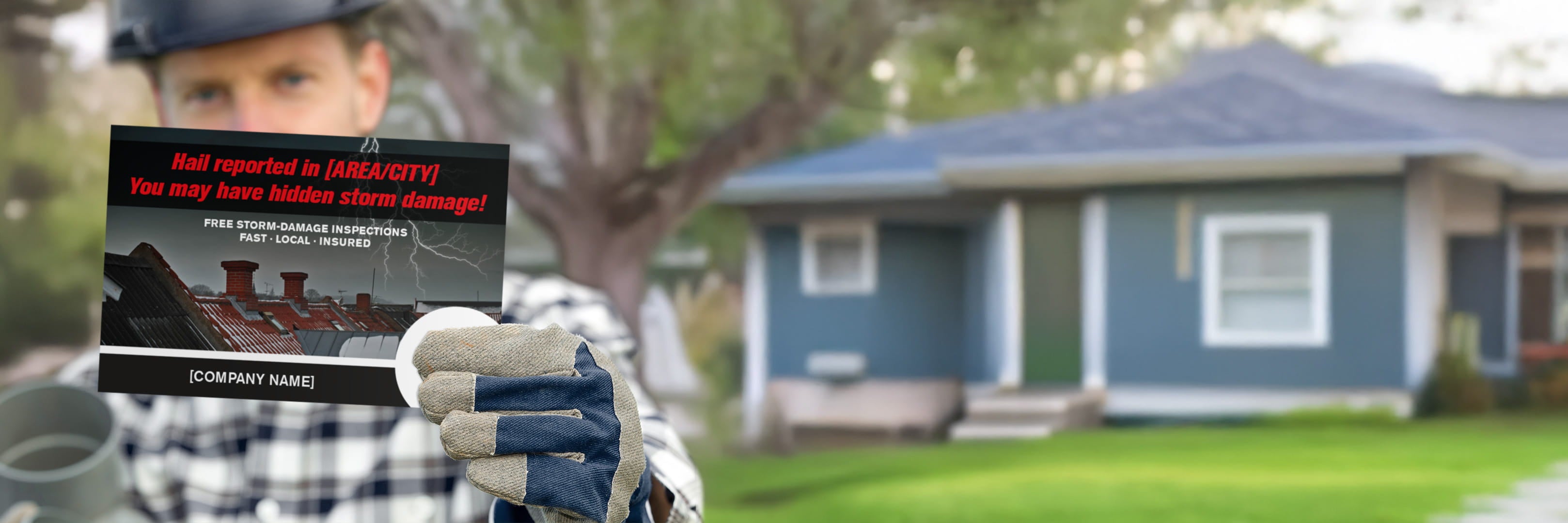 Person holding a sign about roof damage in front of a house